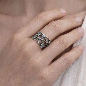 Brand New!! Wavy eternity band with blue opalescent stones